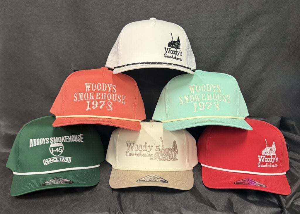 Woody's Smokehouse baseball caps in assorted colors